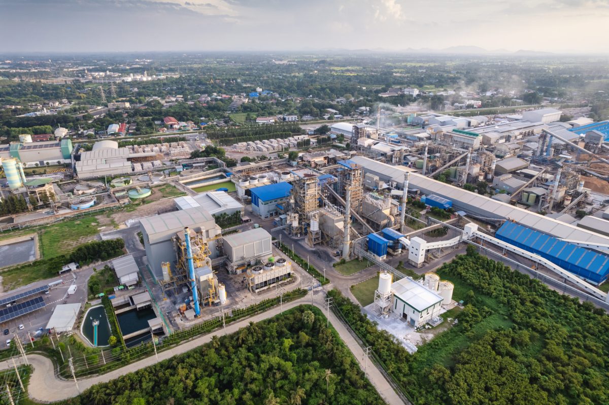 aerial-view-large-green-energy-processing-plant-with-building-warehouse-refinery-tower-warehouse-chemical-processing-technology-scaled-1-1200x799.jpg